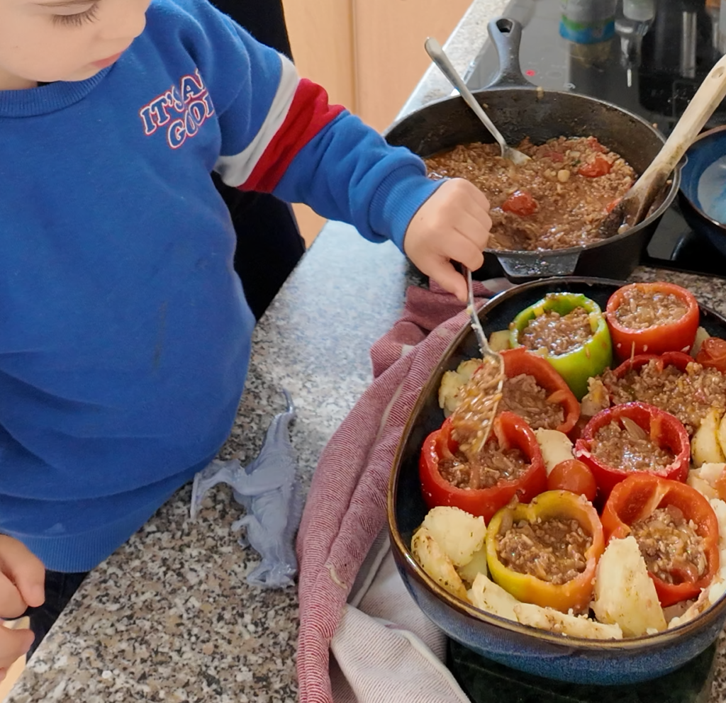 Mummy cooking mediterranean with toddler in the kitchen